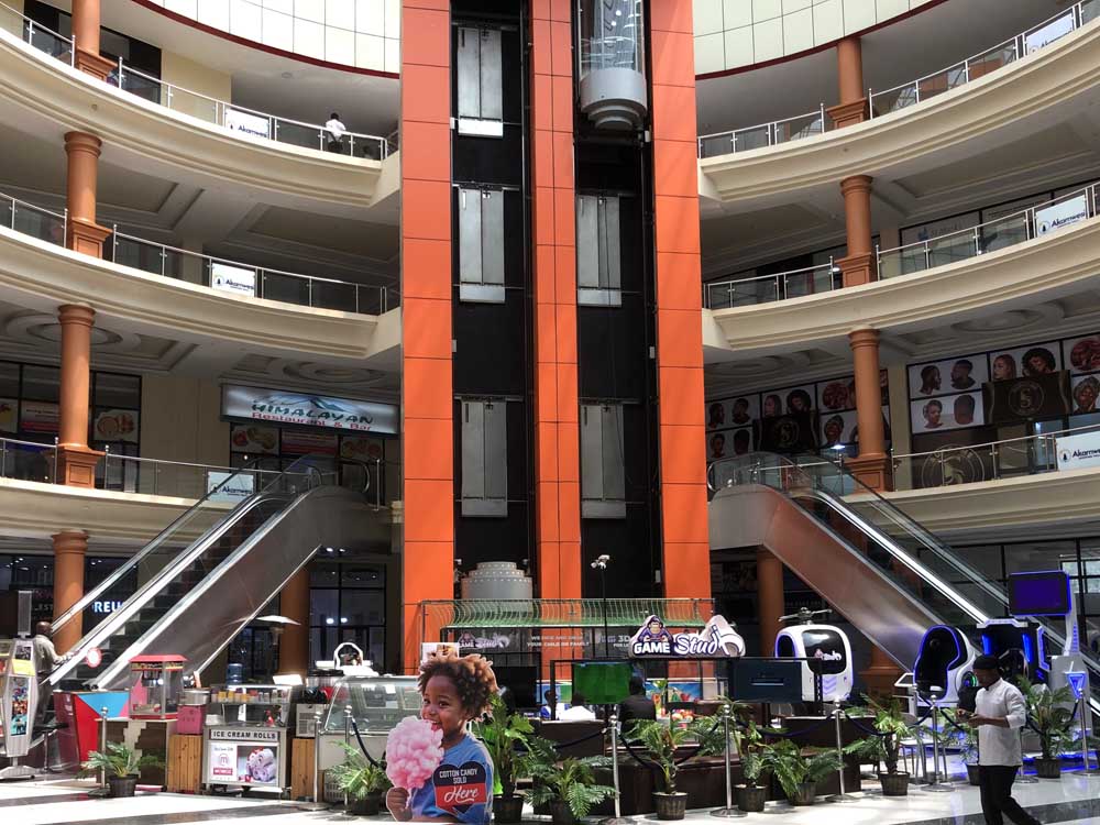 Akamwesi Shopping Mall Kyebando, Kampala Uganda. Services: Super Market, Bars and Restaurants, Wedding Gardens, Kids Park, Swimming Pool, Soccer Turf/Soccer Pitch, Sauna and Steam Bath, Gym, Fashion Stores/Clothes Stores, Beauty Salons, Phone Stores, Furniture Stores, Offices, Car Washing Bays. Ugabox