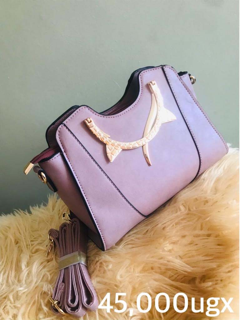 Handbags for Sale in Kampala Uganda. Designer Stylish and Trendy Ladies' Handbags | Women's Bags | Birthday Gift Bags | Order Now for Delivery in Kampala. Calls: +256 781 712 913, Whatsapp: +256 756 758 081. Prettybags, We sell/supply and deliver fashionable womens' bags/ladies' handbags for all events and occasions/women party bags, office bags when you order with us online/call. We are located in Naalya Estate next to Naalya Estate Supermarket 'aka' Lucky7 Supermarket Wakiso Uganda, Ugabox