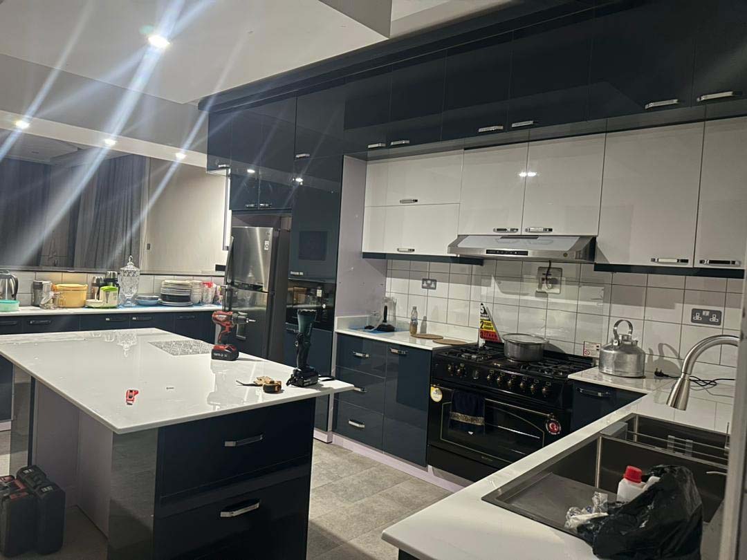 Kitchen cabinets design in Kampala Uganda. Wood cabinets installation. Trust Interiors Uganda. Leading interior design company in Uganda. Services: Interior design services, installation services, manufacturing of modern stylish furniture products in Uganda, East Africa. ugabox.com