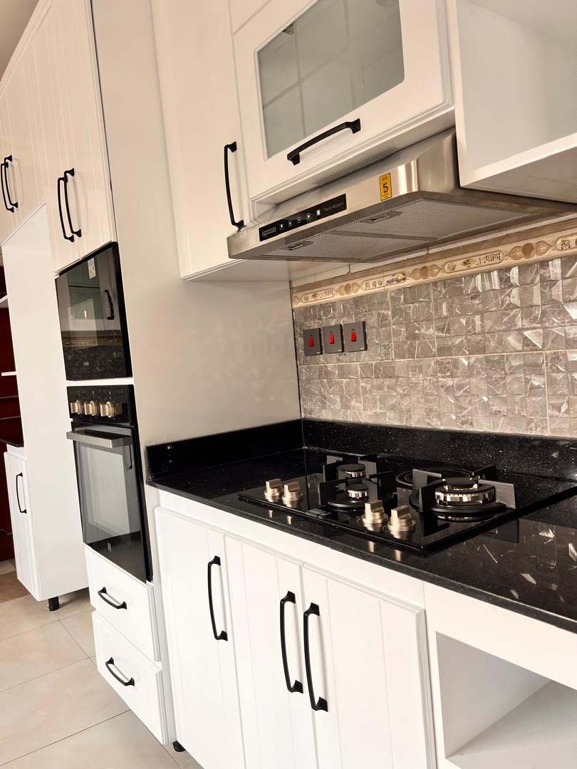 Kitchen cabinets design in Kampala Uganda. Wood cabinets installation. Trust Interiors Uganda. Leading interior design company in Uganda. Services: Interior design services, installation services, manufacturing of modern stylish furniture products in Uganda, East Africa. ugabox.com