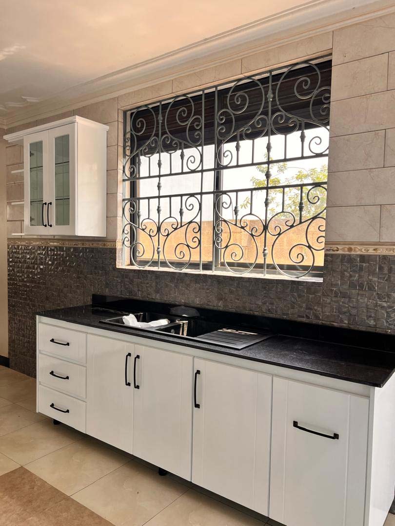 Kitchen cabinets design in Kampala Uganda. Wood cabinets installation. Trust Interiors Uganda. Leading interior design company in Uganda. Services: Interior design services, installation services, manufacturing of modern stylish furniture products in Uganda, East Africa. ugabox.com