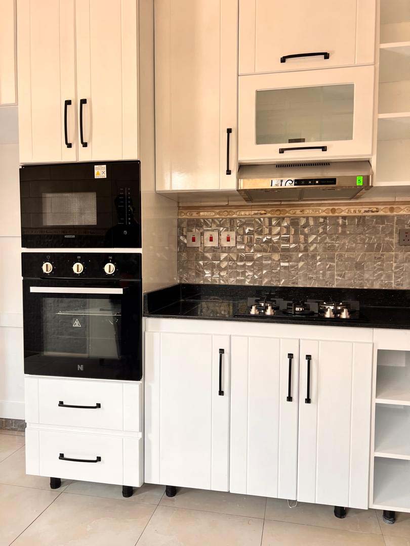 Kitchen cabinets design in Kampala Uganda. Wood cabinets installation. Trust Interiors Uganda. Leading interior design company in Uganda. Services: Interior design services, installation services, manufacturing of modern stylish furniture products in Uganda, East Africa. ugabox.com