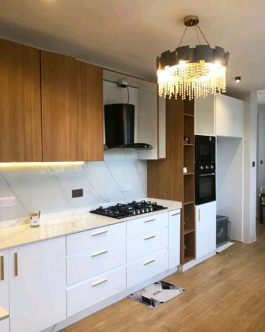 Kitchen cabinets design in Kampala Uganda. Wood cabinets installation. Trust Interiors Uganda. Leading interior design company in Uganda. Services: Interior design services, installation services, manufacturing of modern stylish furniture products in Uganda, East Africa. ugabox.com